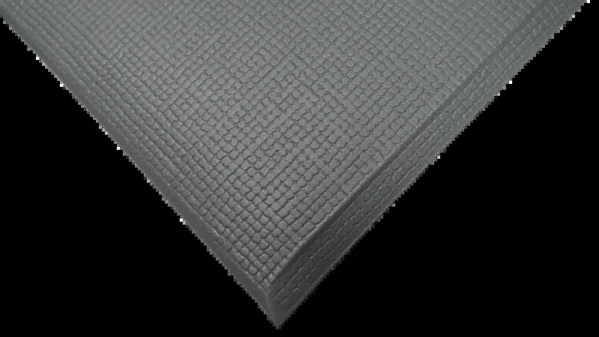 Corner of Grid Grey matting showing the 9.5 mm thickness and the bevelled edge