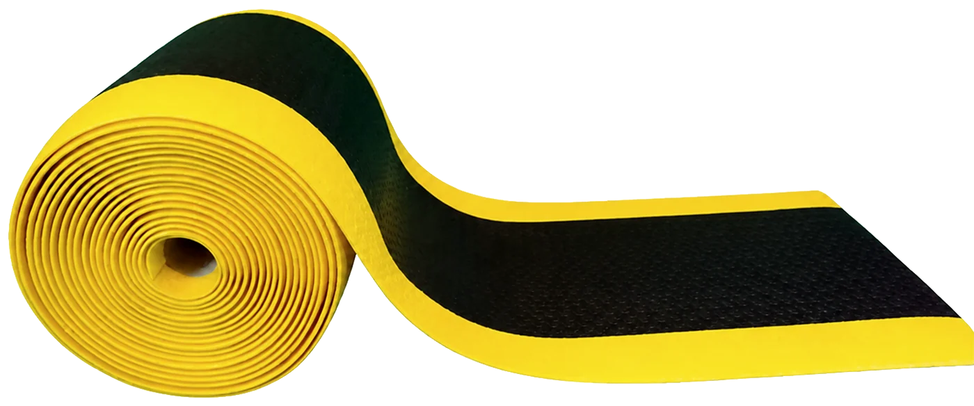 A cut length of matting rolled up, showing the yellow bevel down the long edge