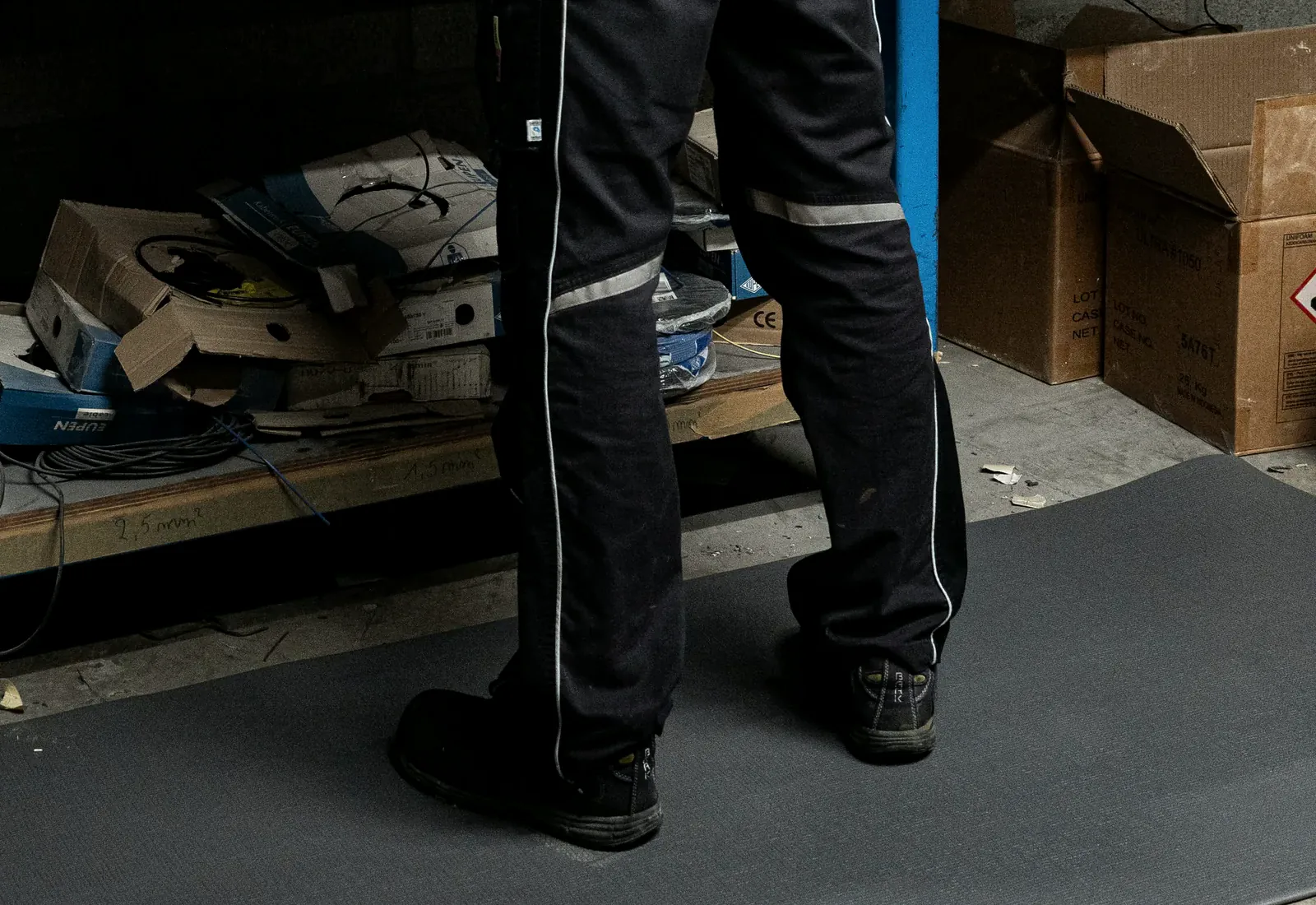 Grey Grid matting laid at a workshop bench, cut end against the bay